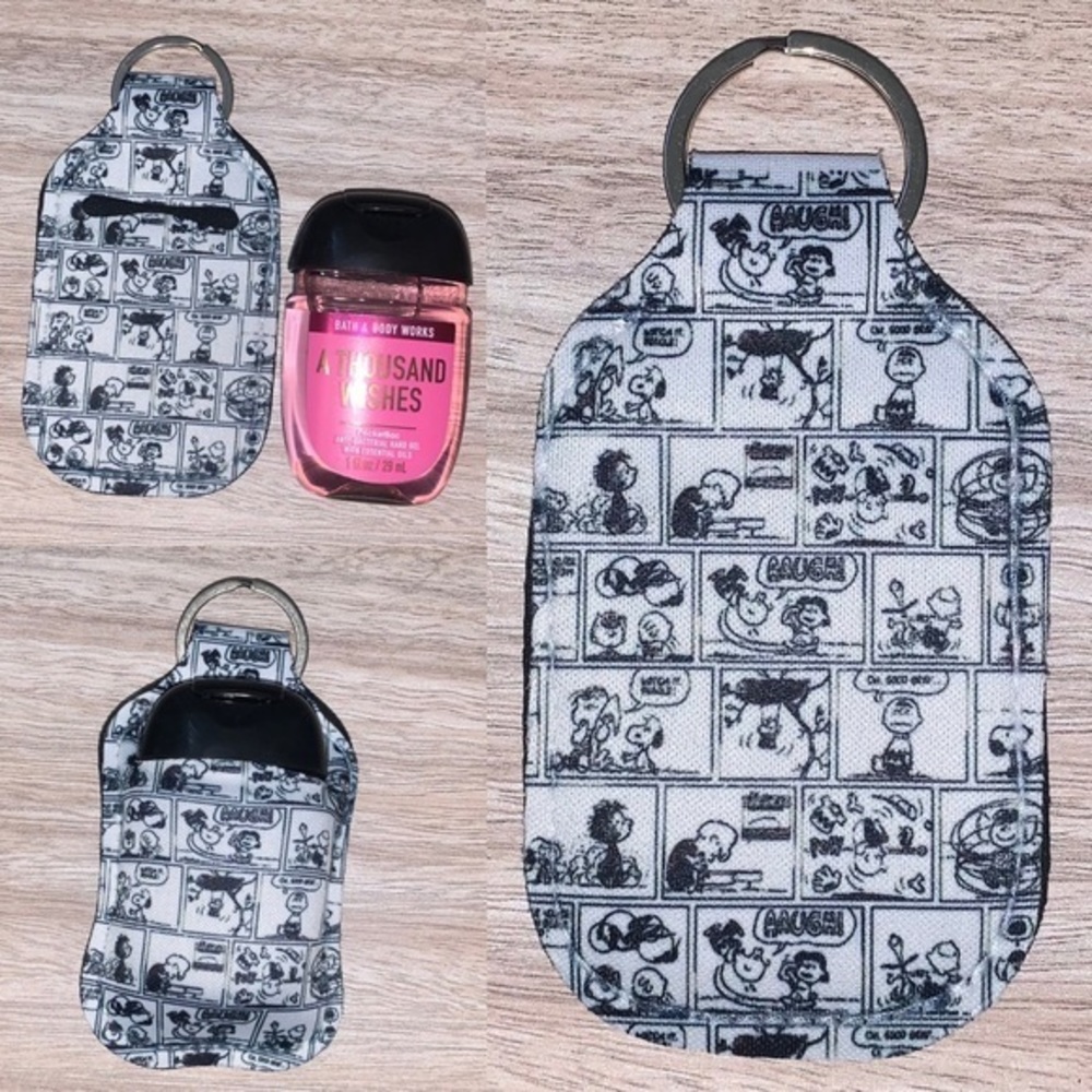 Peanuts snoopy comic strip hand sanitizer holder new